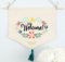 Welcome a new friend or neighbor by adding this free welcome wreath embroidery design to a dishtowel, banner, pillow or flag. #freeembroiderydesign #embroiderydesign